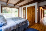 Main floor king bedroom with private deck